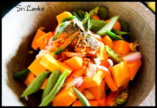 a bowl of food with carrots and green vegetables at East Surf Cabana in Arugam Bay