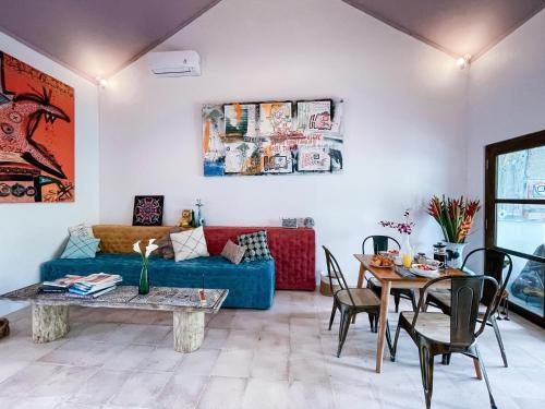 a living room with a couch and a table at 2BR Art Villa Bingin in Uluwatu