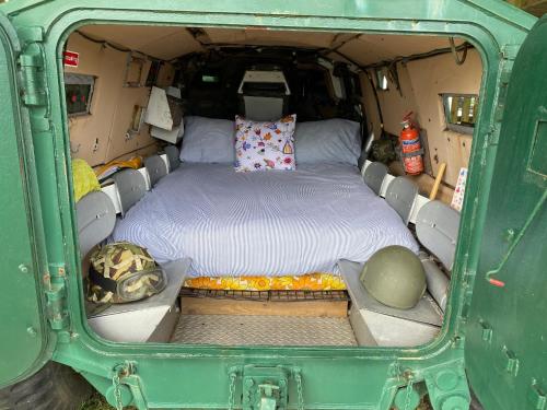 a bed in the back of a green van at Stunning views & sunrises from Sally Saracen in St Ives