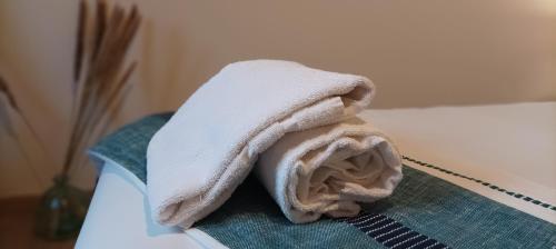 a white towel sitting on top of a table at Centre - L'escapade in Mutzig
