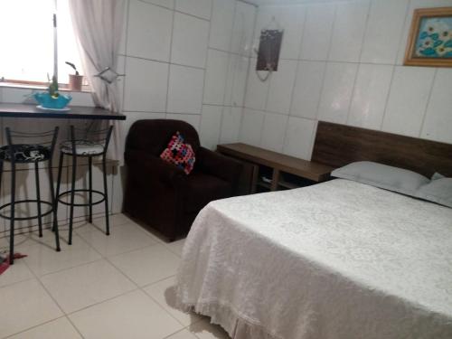 Cama o camas de una habitación en Cantinho Aconchego