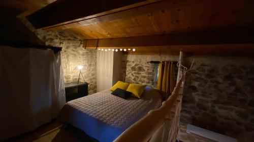 Cama ou camas em um quarto em La Magnanerie du Castanet