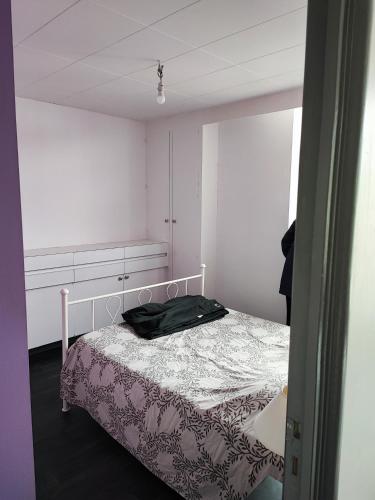 Postel nebo postele na pokoji v ubytování Appt Poincaré