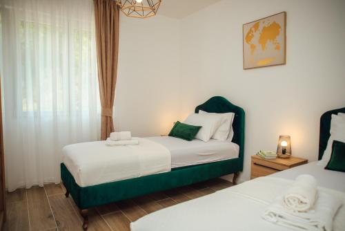 En eller flere senge i et værelse på Baia di Cattaro