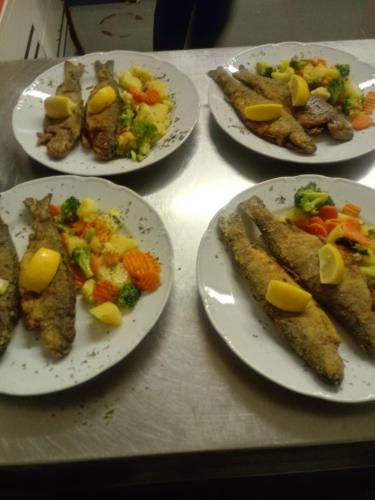 a group of plates of food on a table at Motel and Restaurant Odušak in Drežnjak