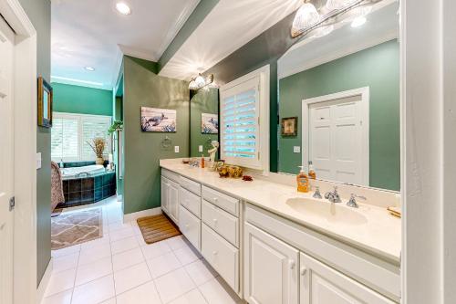 a bathroom with a sink and a mirror at 43 Trumpet Creeper in Kiawah Island