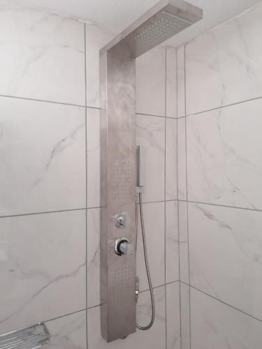 a shower with a glass door in a bathroom at Countryside Retreat 3 in Agios Arsenios