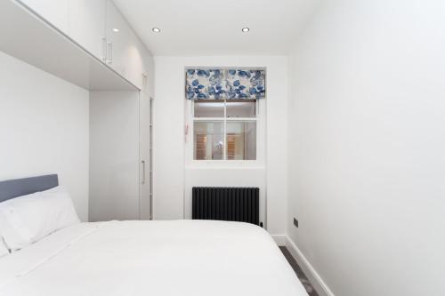 En eller flere senger på et rom på Luxury Escapes @ London Victoria