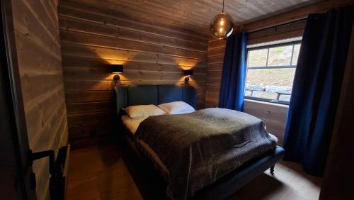 Postel nebo postele na pokoji v ubytování Mlodge - The Mountain Lodge