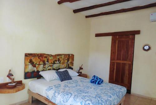 Postel nebo postele na pokoji v ubytování Art Maya Rooms
