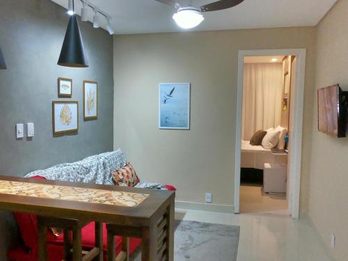 En eller flere senge i et værelse på Apart. Acolhedor na Praia de Itapuã