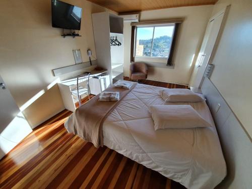 Ένα ή περισσότερα κρεβάτια σε δωμάτιο στο HOTEL MARTELLO