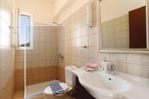 A bathroom at Villa Olympios Springs by Villa Plus