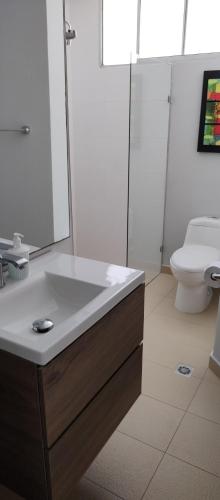 a bathroom with a sink and a toilet at Vista Playa in Cartagena de Indias