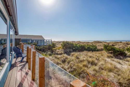 a porch of a house with a view of the beach at Oceania House in Waldport
