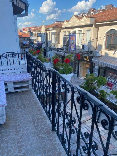 a balcony with a black railing and some buildings at Galeb Apartment Ohrid in Ohrid