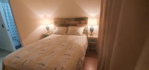 Postel nebo postele na pokoji v ubytování Arriendo departamento