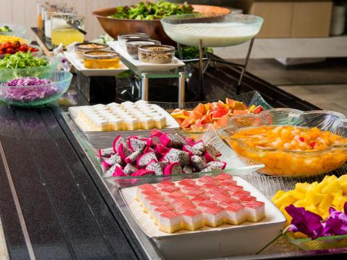a buffet with many different types of food on a table at Hotel Monterey Okinawa Spa & Resort in Onna