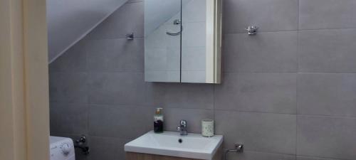 a bathroom with a sink and a mirror at Oasis in Nafplio