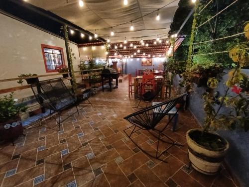 a restaurant with a patio with a table and chairs at Posada Casa Mexicana Jamaica in Mexico City