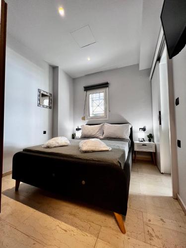 a bedroom with a large bed in a room at Central Double Room Ground floor in Heraklio