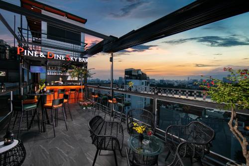 a bar on the roof of a building with a view at Bendecir Hotel & Spa in Hanoi