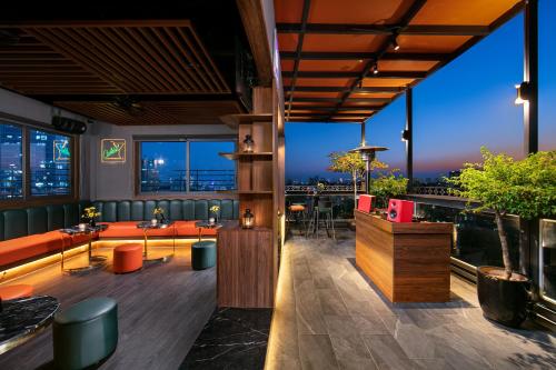 a bar with a view of the city at Bendecir Hotel & Spa in Hanoi
