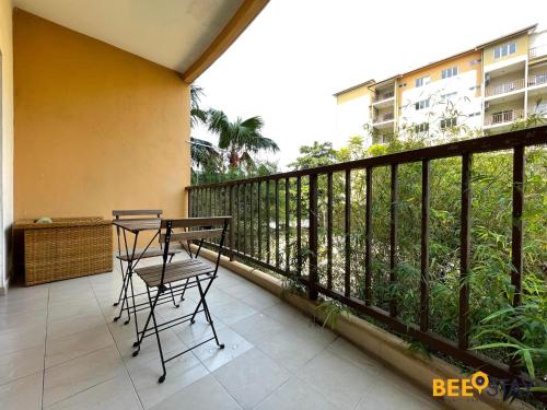 a balcony with a table and chairs on it at Gold Coast Morib Studio l Apartment I Penthouse in Banting