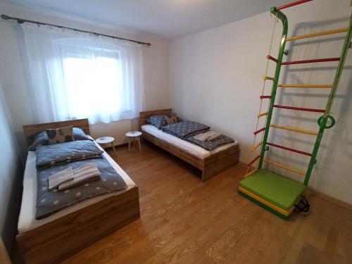 Posteľ alebo postele v izbe v ubytovaní Apartament Sówka
