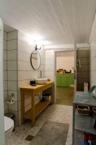 a bathroom with a sink and a toilet at Skounas Home in Leonidio