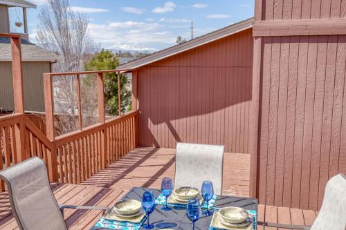 a patio with a table and chairs on a deck at Hunters Circle - Meredith Lodging in Bend