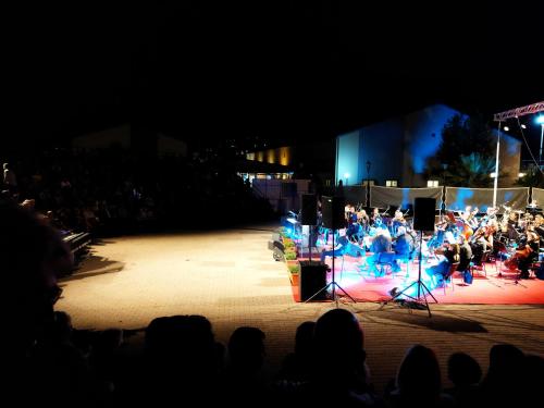 a group of people on a stage at night at COZZY STUDIO IN NEA MAKRI in Nea Makri