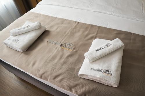 Kristall Apartments Premiumにあるベッド