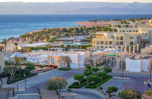 an aerial view of a town next to the ocean at Tala Bay Residence in Aqaba