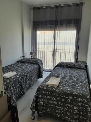 A bed or beds in a room at África View