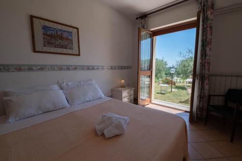 Posteľ alebo postele v izbe v ubytovaní Poggio delle Rose Tuscany Relais