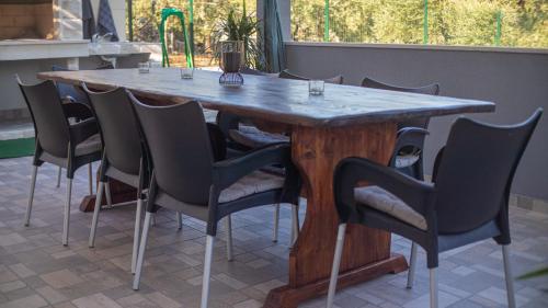 a wooden table with chairs around it on a patio at Casa Bella in Split