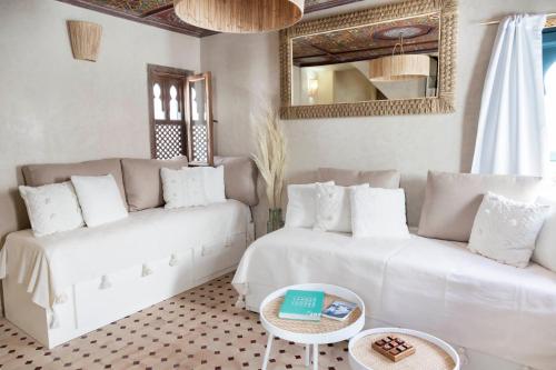 a living room with a couch and a table at Dar Tahendit in Tangier