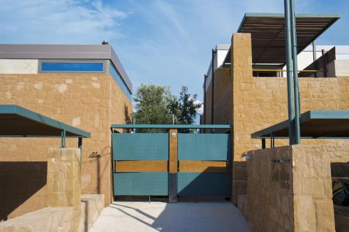 a blue gate in front of a building at Conte Marino Villas in Maleme