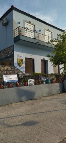 a building with graffiti on the side of it at Ilio Socrates in Skala Marion