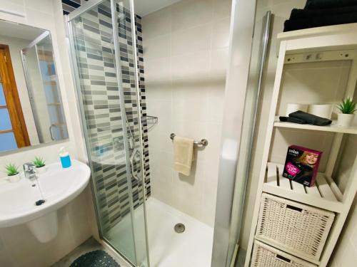 a bathroom with a shower and a sink at Beach Apartment 9 in Patalavaca