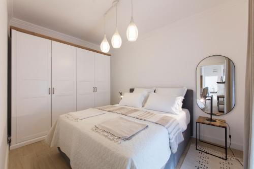 מיטה או מיטות בחדר ב-Spring Apartment