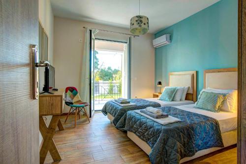 Posteľ alebo postele v izbe v ubytovaní Villa Sofinta by Villa Plus