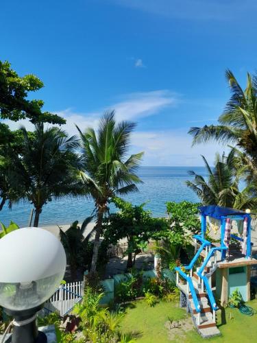 a view of the ocean from a resort at Toni Arts Villa in Nabas