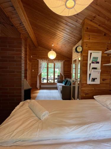 a bedroom with a large bed in a room at Villa Safari in Perniö