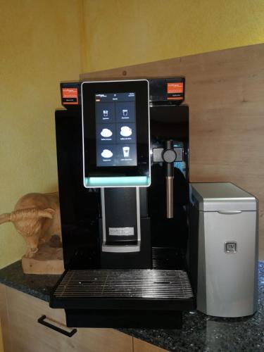 a coffee machine sitting on top of a counter at Pension Sonnleitner in Heiligenblut