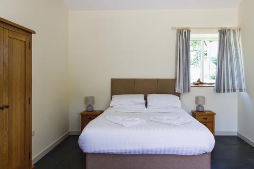 Postel nebo postele na pokoji v ubytování Broomhill Barns