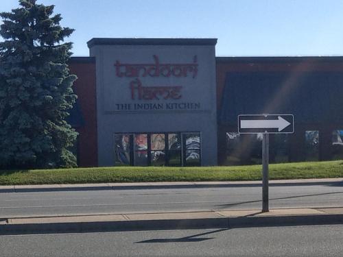 a street sign in front of a building at Home Stay near the Airport in Mississauga