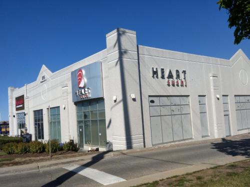 a large white building with a heart sign on it at Home Stay near the Airport in Mississauga