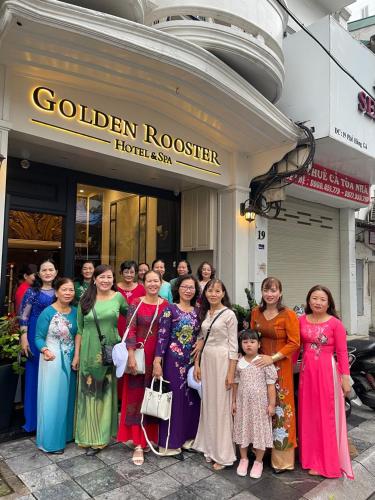 a group of women standing in front of a hotel at Golden Rooster Hotel in Hanoi